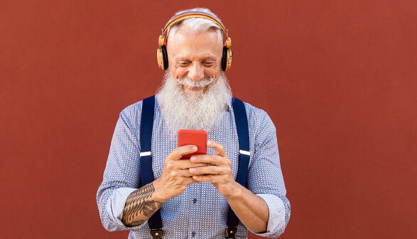 Senior hipster man using mobile smartphone